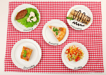 Daily menu. Plates with food on table