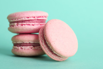 Gentle colorful macaroons on color background