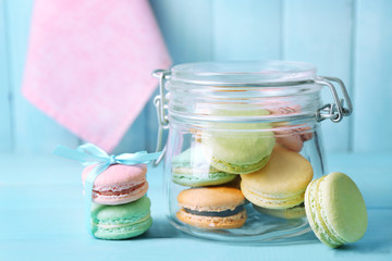 Gentle colorful macaroons in glass jar