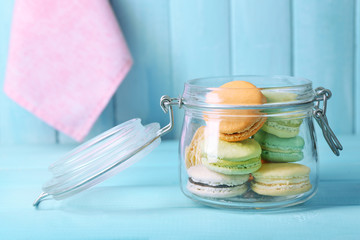 Gentle colorful macaroons in glass jar