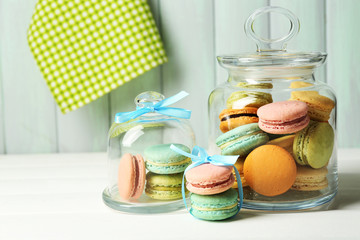 Gentle colorful macaroons in glass jars