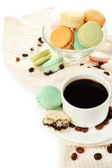 Gentle colorful macaroons in glass bowl and black coffee in mug