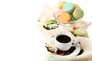 Fototapeta na wymiar Gentle colorful macaroons in glass bowl and black coffee in mug