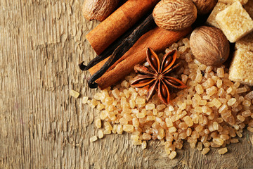 Christmas spices and baking ingredients on wooden background