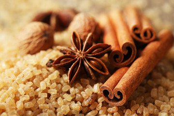 Christmas spices and baking ingredients on wooden background