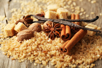Christmas spices and baking ingredients on wooden background