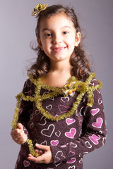 little girl with Christmas decorations
