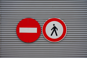 sign prohibiting pedestrian access on metal wall