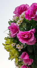 Isolates bouquet of pink roses and other decorations nicely.