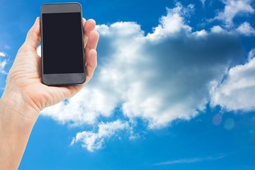 Composite image of woman showing black smartphone screen