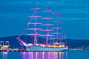 Old wooden illuminated sailboat night view