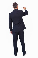Rear view of a businessman drawing with a chalk