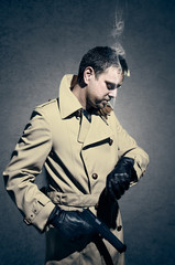 Killer standing on dark background waiting time to kill