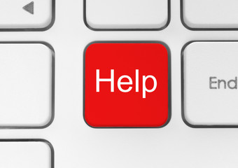 Red help button on the keyboard close-up.