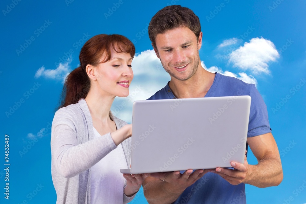 Poster composite image of couple using a laptop together