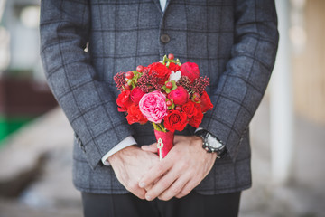Wedding bouquet in men hands