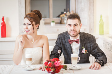 the bride and groom drink latte