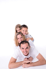Fototapeta premium isolated studio shot happy family of four with little kids