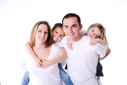 isolated studio shot happy family of four with little kids