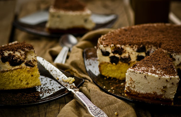 cheesecake with prunes and chocolate cut on pieces
