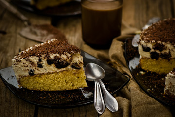 cheesecake with prunes and chocolate cut on pieces