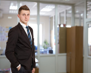 Young male businessman in the office