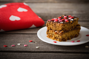 cake with hearts on wooden background