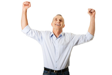 Portrait of cheerful man with hands up