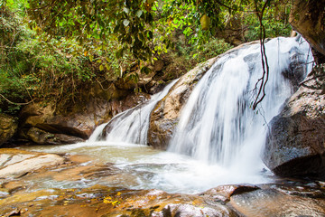 Scenic waterfall flowing on stone at Mae Sa waterfall Doi Suthep