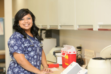 Female Hispanic Nurse at work place, hospital