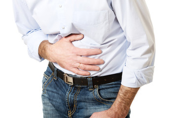 Close up on mature man suffering from stomachache