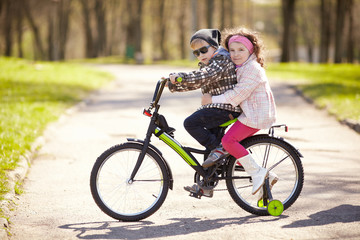 girl and boy riding on bicycle