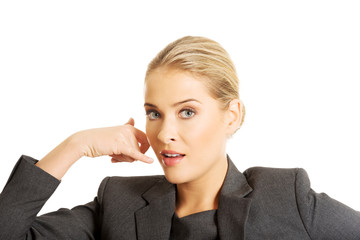 Woman making phone gesture