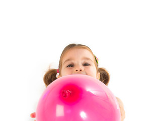 Fototapeta na wymiar Kid playing with balloons over white background