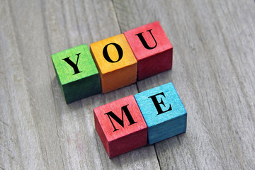 you and me words on colorful wooden cubes, concept of dating