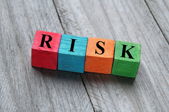 concept of risk on colorful wooden cubes