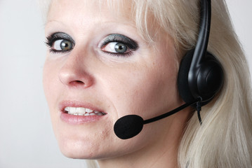 Portrait of young woman with headset