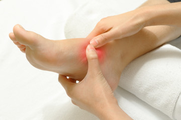 Doctor examining an injured foot,sport injury