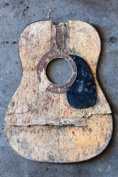 Broken acoustic guitar