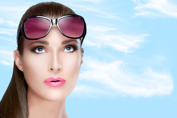 Beautiful Woman in Red Violet Shades Looking up. Bright Makeup a