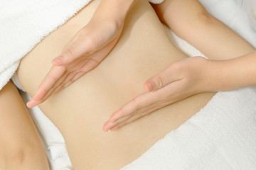 Fototapeta na wymiar Masseur applying massage techniques to relax back muscles in