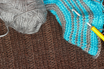 Gray silky yarn with striped crochet hook