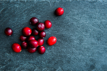 Closeup on lingonberries on stone substrate