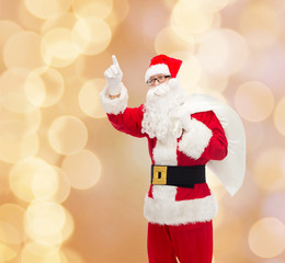 man in costume of santa claus with bag