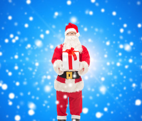 man in costume of santa claus with gift box