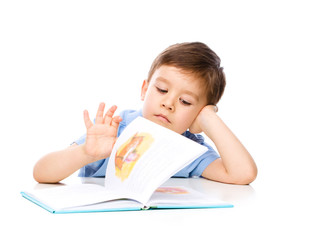 Little child play with book