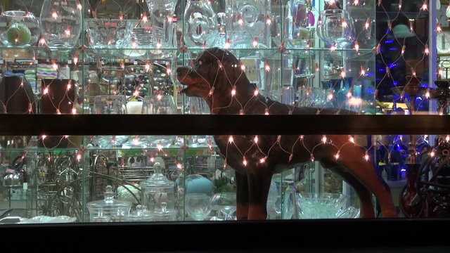 Christmas New Year shop window  decoration and dog sculpture.
