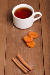 cup of tea on an old wooden table. small depth of field