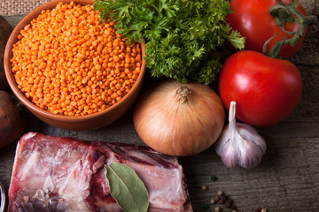 Ingredients for Turkey vegetable soup with red lentils, lying on