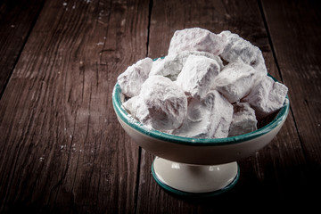 Turkish Delight in a ceramic vase on a wooden background